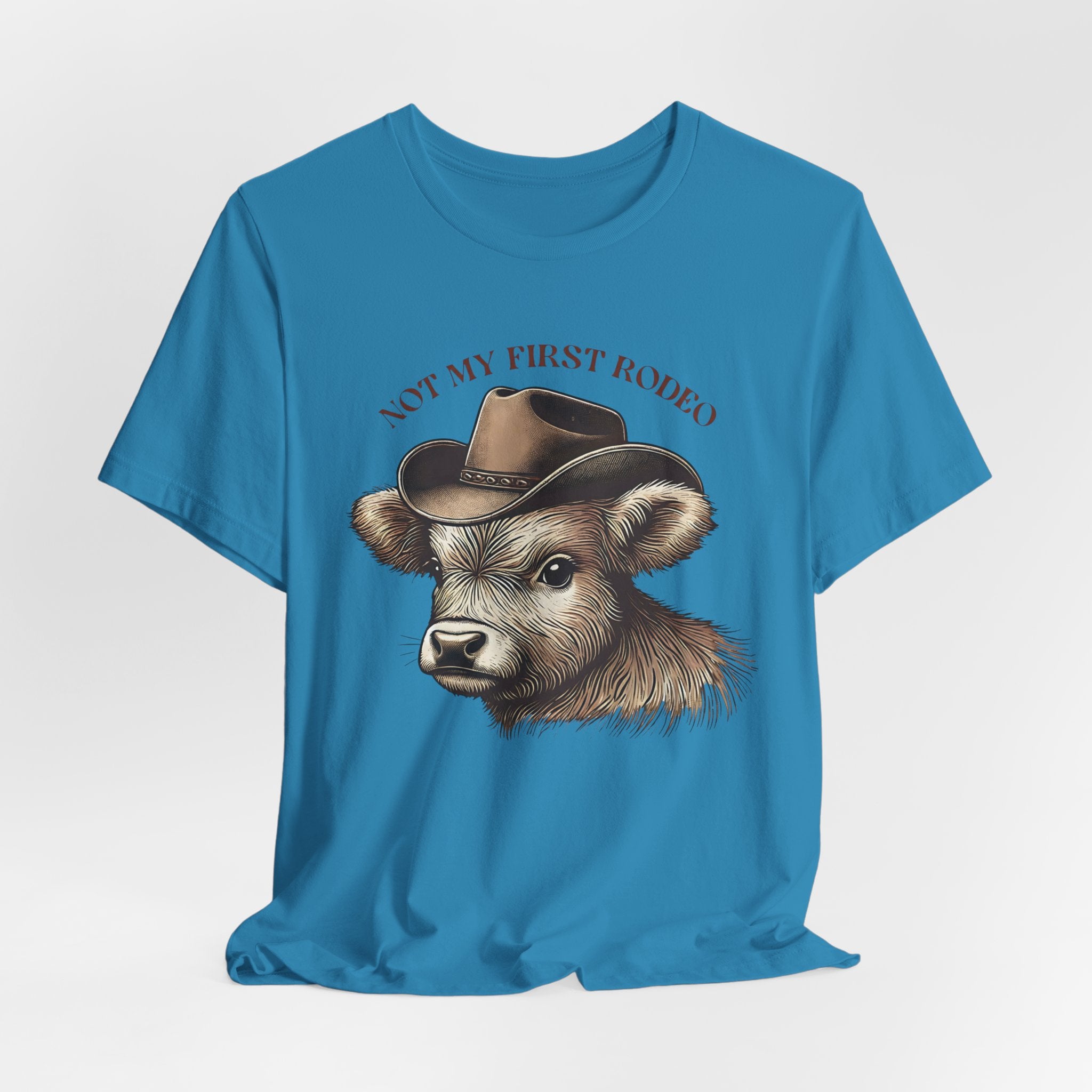 Not My First Rodeo Cow Tee — Western Cow with Cowboy Hat Graphic