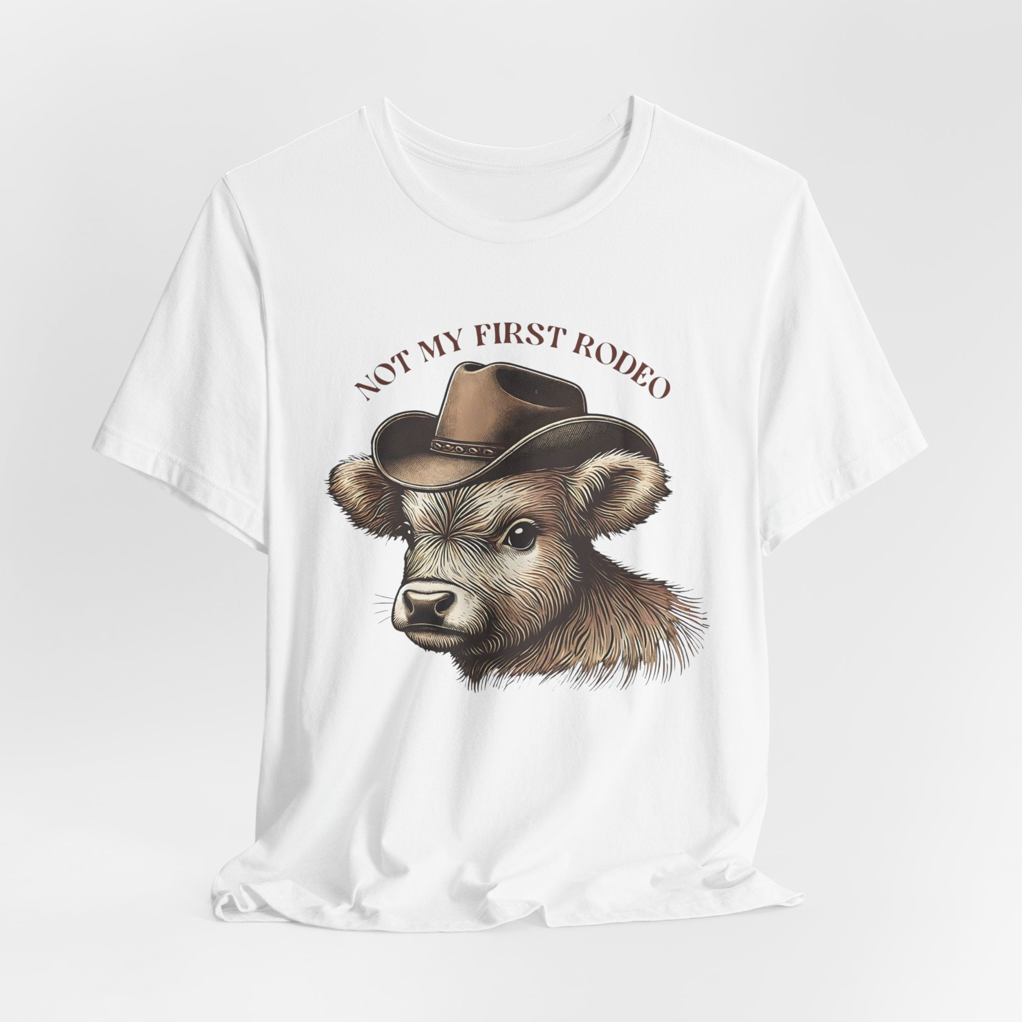Not My First Rodeo Cow Tee — Western Cow with Cowboy Hat Graphic