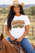 Close-up of the Black cowgirl on horseback wearing the white Pasture Raised tee