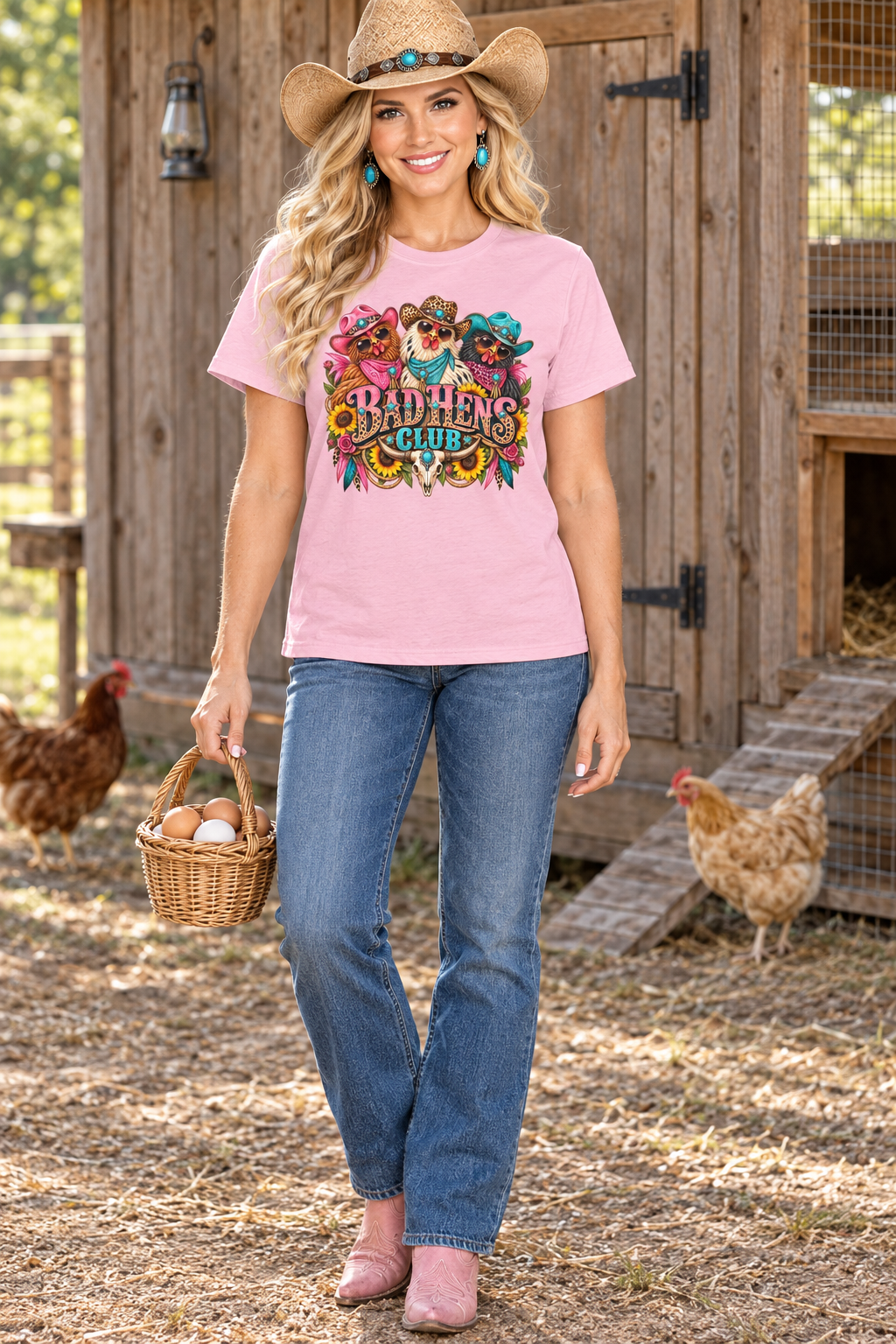 Cowgirl wearing the pink Bad Hens Club tee carrying an egg basket beside a rustic chicken coop