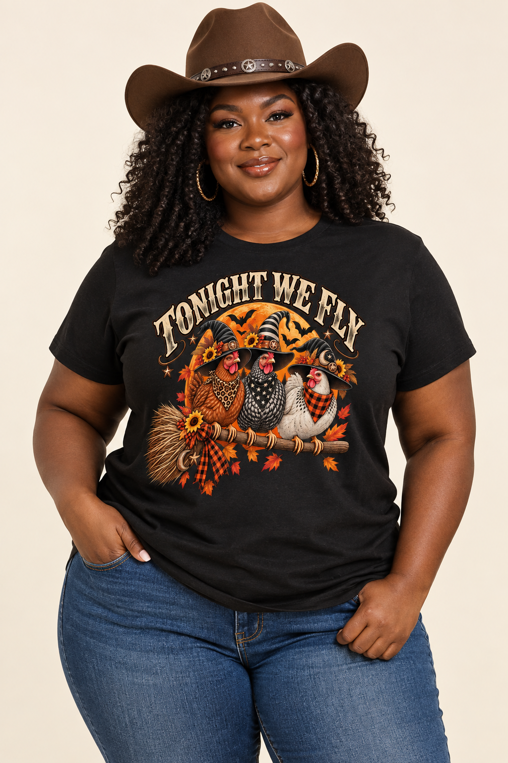 Plus-size Black cowgirl wearing the black Witchy Hens tee