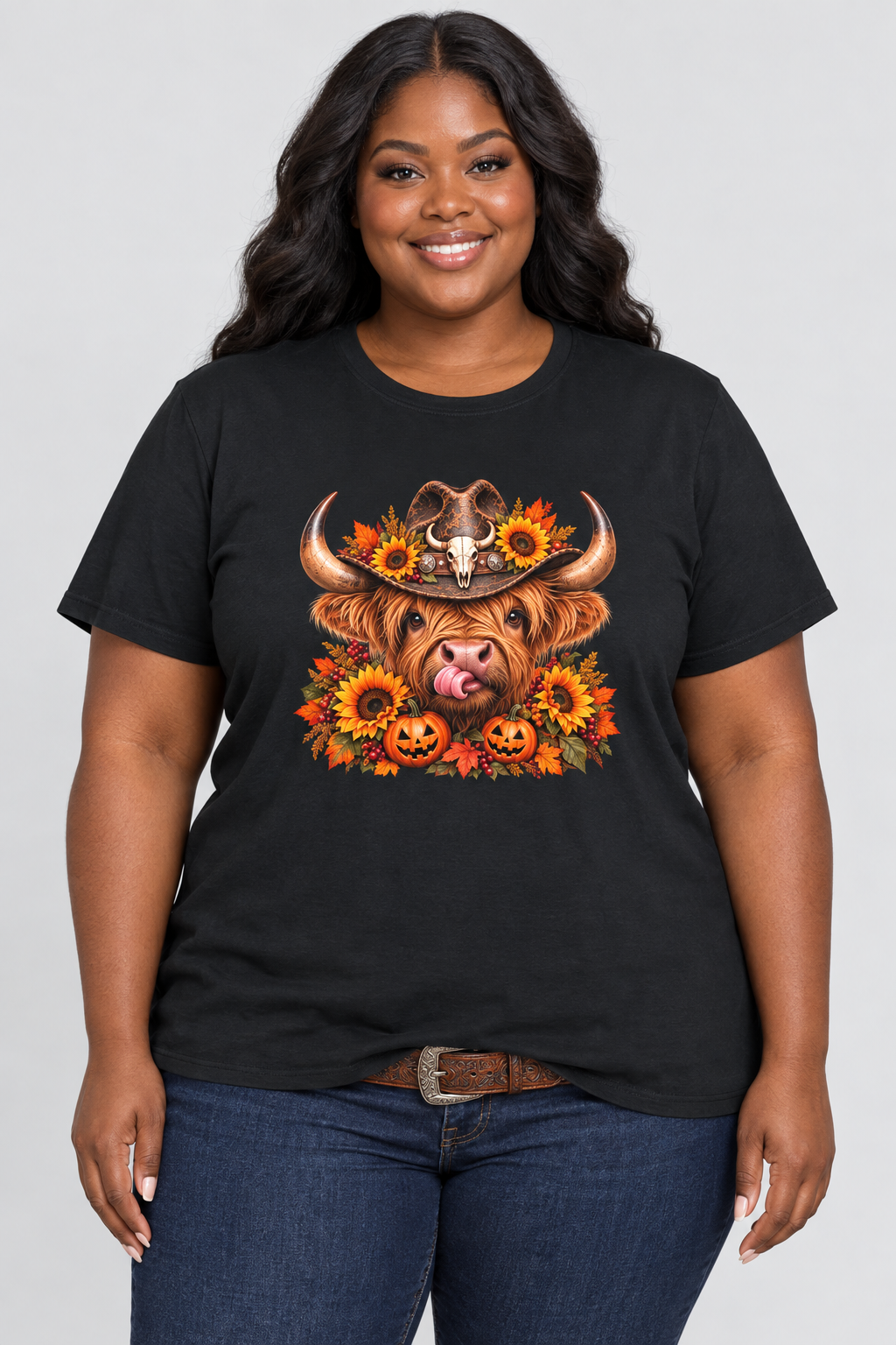 Plus-size Black model wearing the black Highland Cow Halloween tee